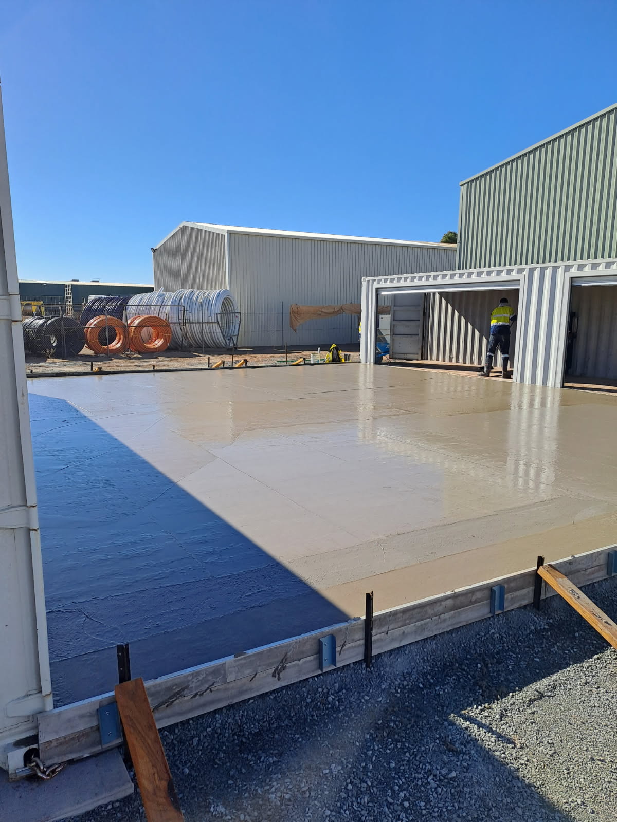 Large fresh concrete slab pour on industrial site by Phoenix Goldfields