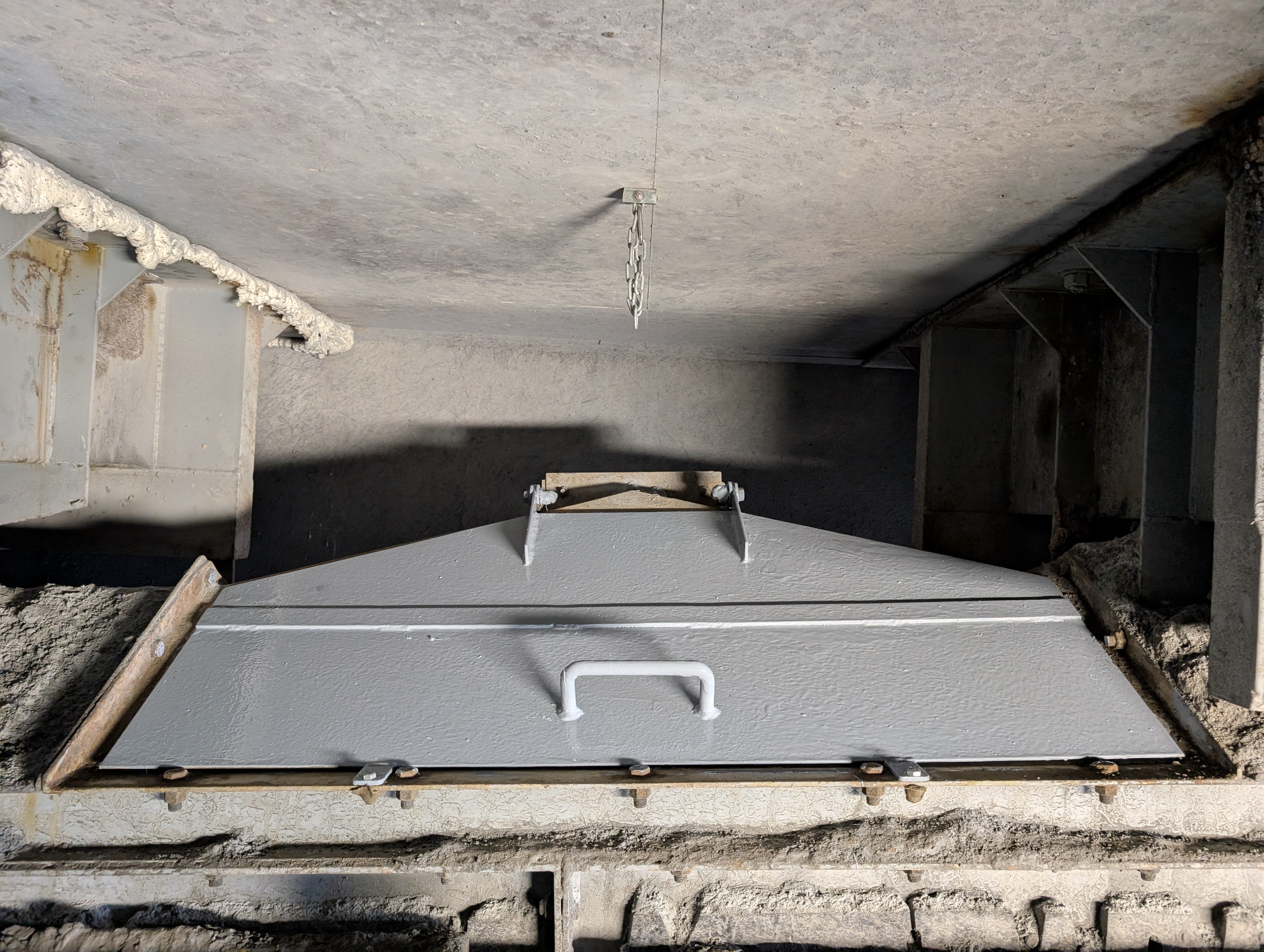 Fabricated steel chute and access hatch installed on mine processing circuit by Phoenix Goldfields