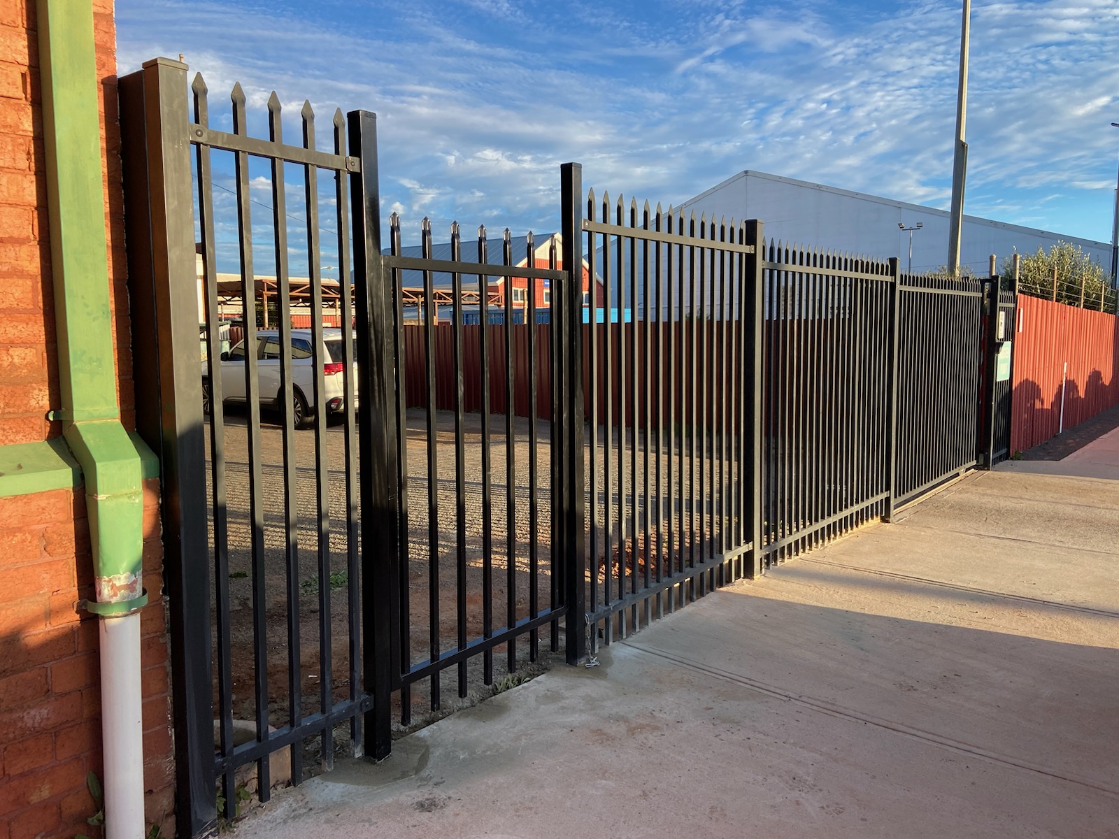 Steel palisade fencing and sliding gate installed at commercial property by Phoenix Goldfields