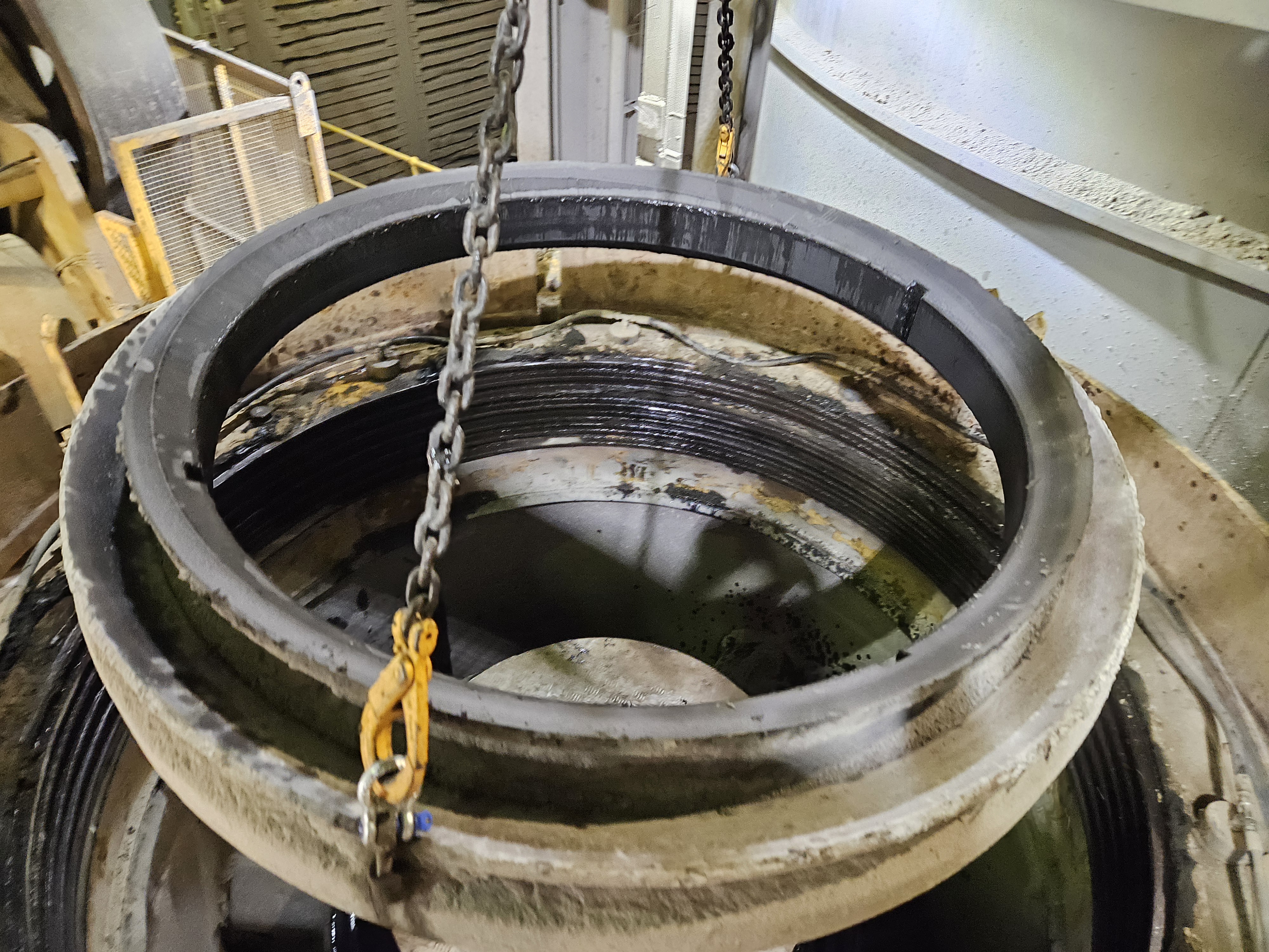 Crusher bowl being lifted by chain during fixed plant overhaul by Phoenix Goldfields